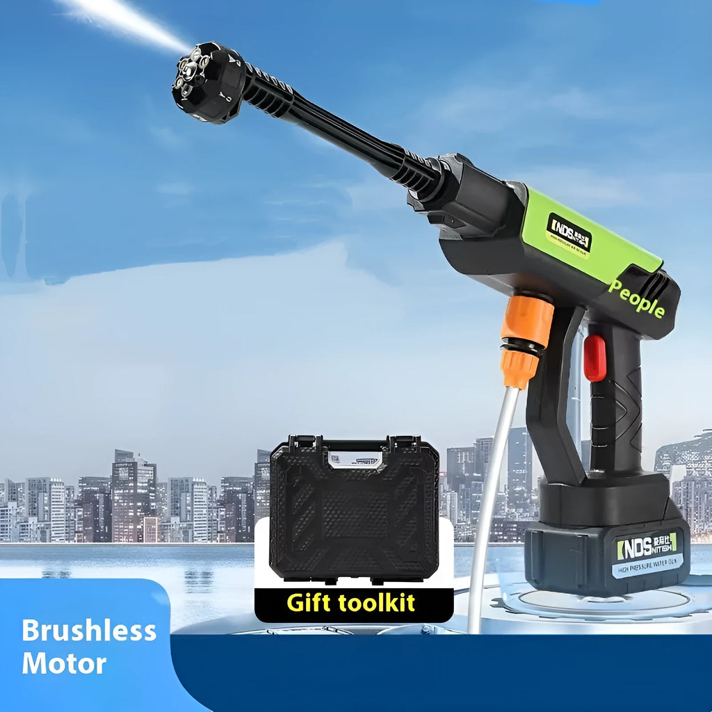 Green wireless high-pressure water gun with metal nozzle and multiple attachments on a table