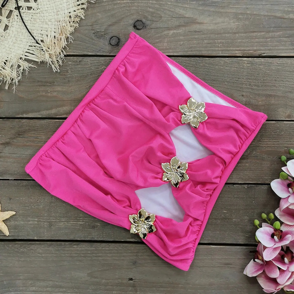 Women's solid colour one-piece swimsuit with high waist and hollow-out tube top, paired with a matching short skirt.