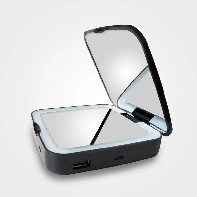 Black and white lighted makeup mirror showing magnifying side and adjustable LED light controls.