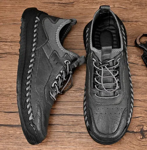 Men's hand-stitched round toe sneakers in black synthetic PU, low heel 1-3 cm, lace-up closure, side view
