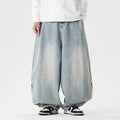 Men's plus-size baggy blue denim jeans with straight leg and low waist on a neutral background.