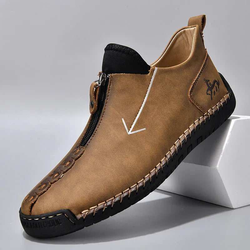Men's brown casual leather-style boots with a front zip, round toe, and mid-calf height.