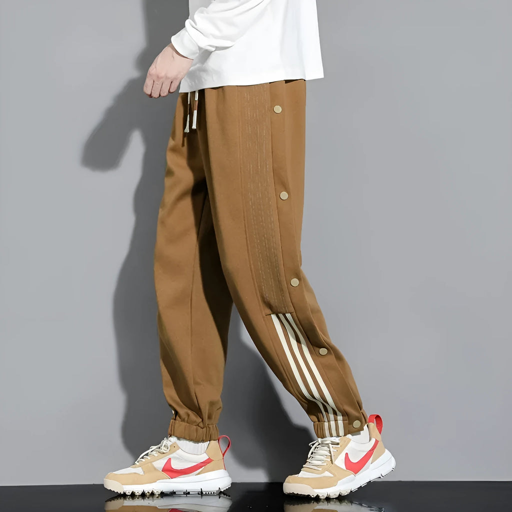 Men's black sports sweatpants with high waist, drawstring closure and ankle ties in cotton blend fabric