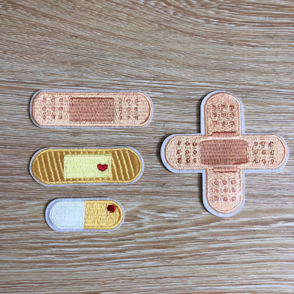 Set of ten embroidered fabric patches with four different style options for clothing decoration