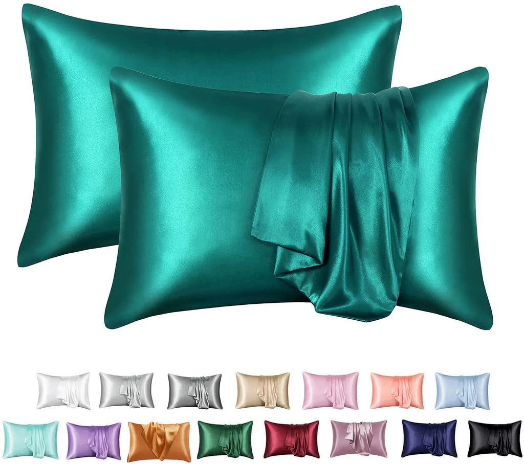 Dark blue polyester satin pillowcase with envelope closure on a bed