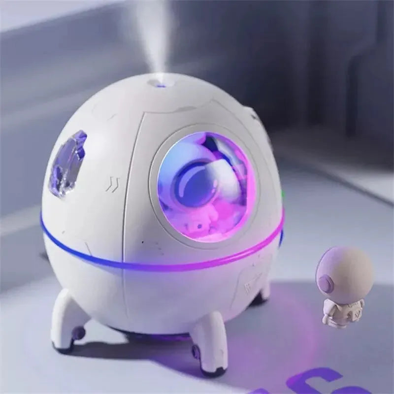 Light purple astronaut-shaped desktop humidifier with LED lights and USB cable