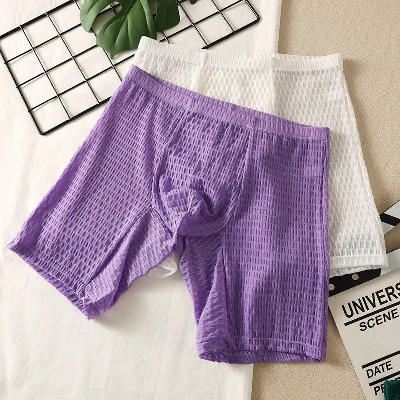 Men's solid colour lace boxer shorts on a white background, showing shaping design.