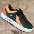 Men's solid-colour casual shoes in artificial PU with round toe, shown in white and orange colourway.