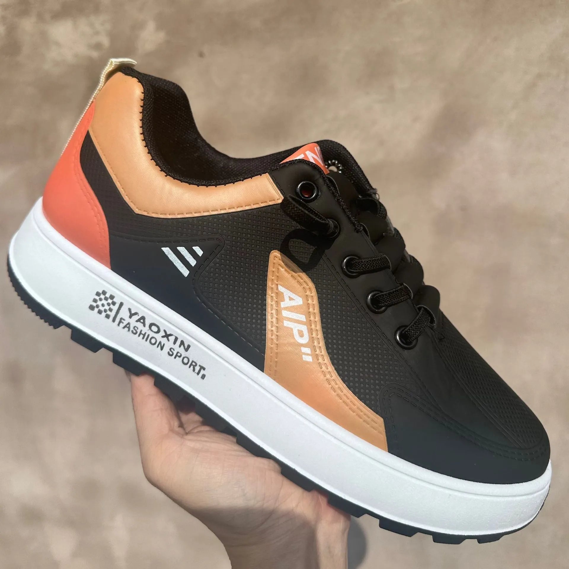 Men's solid-colour casual shoes in artificial PU with round toe, shown in white and orange colourway.