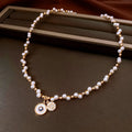 Gold electroplated women's necklace with round pearl pendant and adjustable clavicle chain