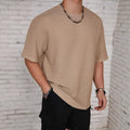 Men's slim fit solid colour round neck T-shirt on a hanger, shown in light blue.