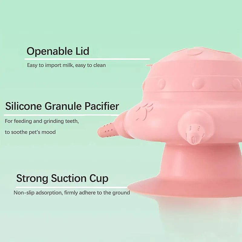 Pink silicone pet nursing device with bionic breast-shaped bowl and flat base for puppies and kittens.