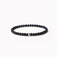 Fine geometric bracelet with black obsidian, blue san, and black agate 4mm beads on an adjustable band.