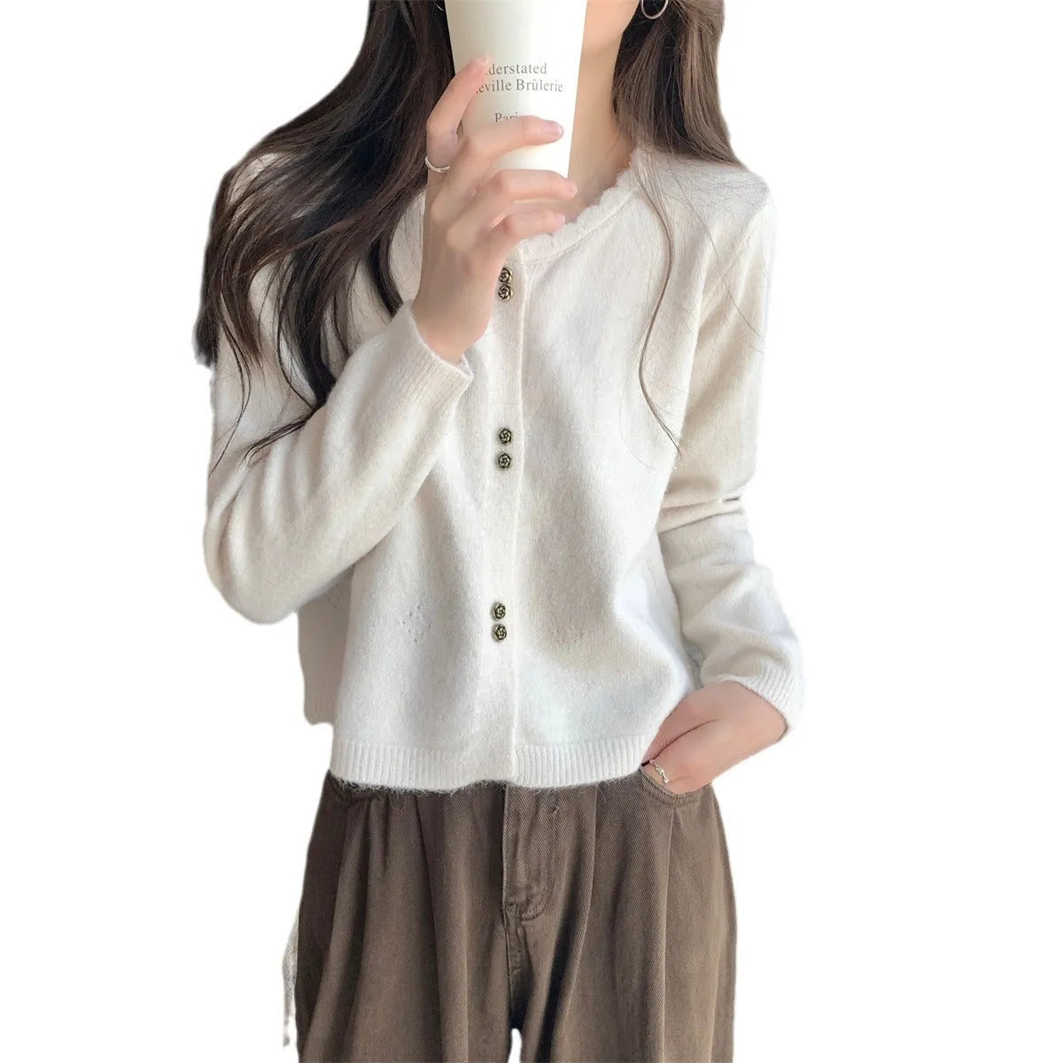 Women's long-sleeved acrylic cardigan coat in milky white, shown with a front opening.