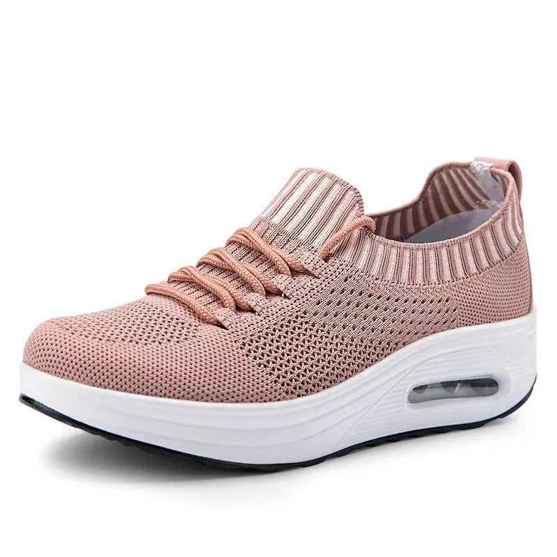 Women's mesh low-top air cushion thick sole breathable shoes in white with rubber soles showing side view