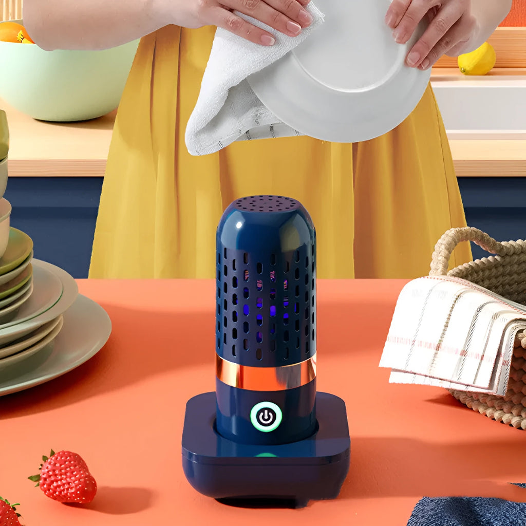 Blue capsule fruit and vegetable purifier with USB charger on a kitchen countertop