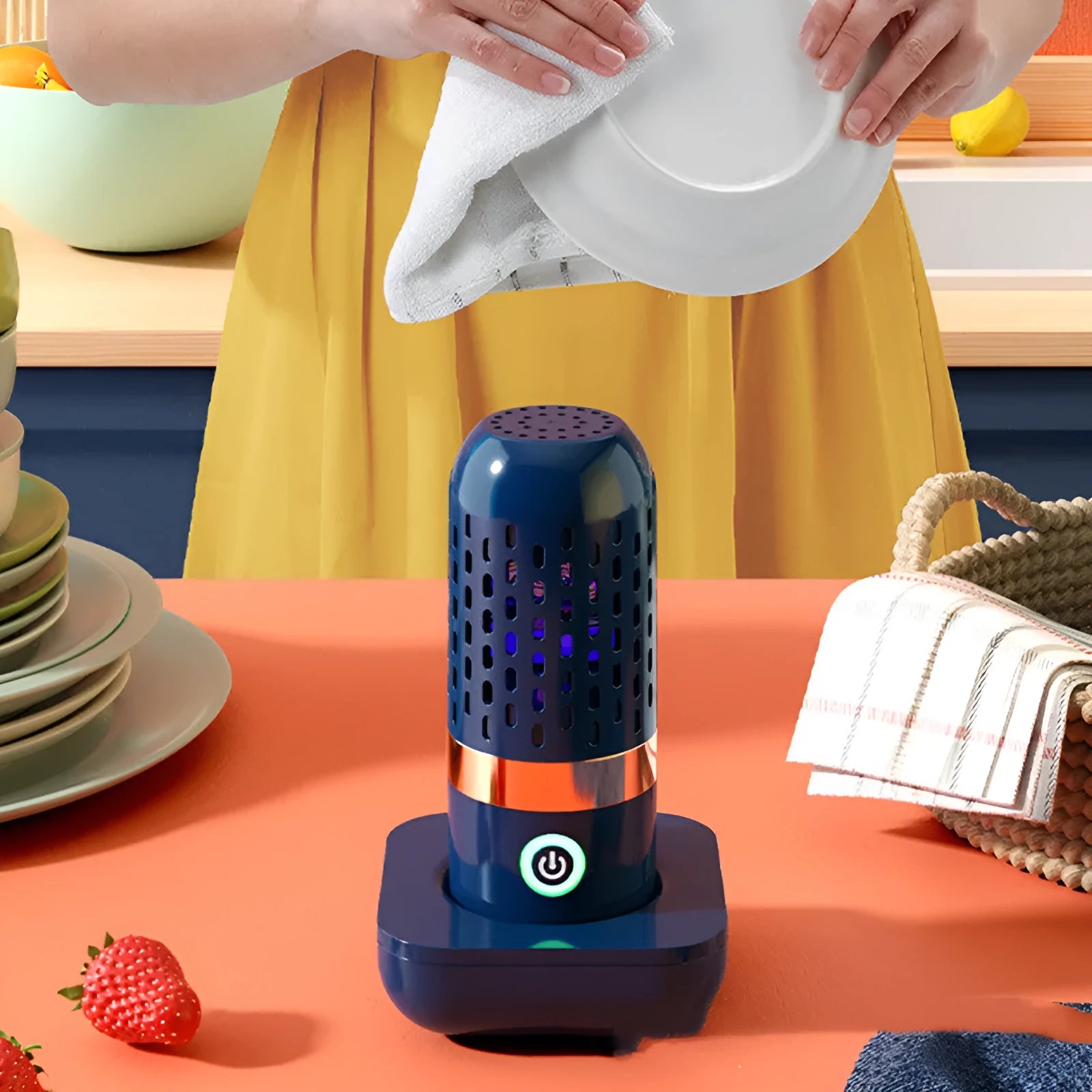 Blue capsule fruit and vegetable purifier with USB charger on a kitchen countertop
