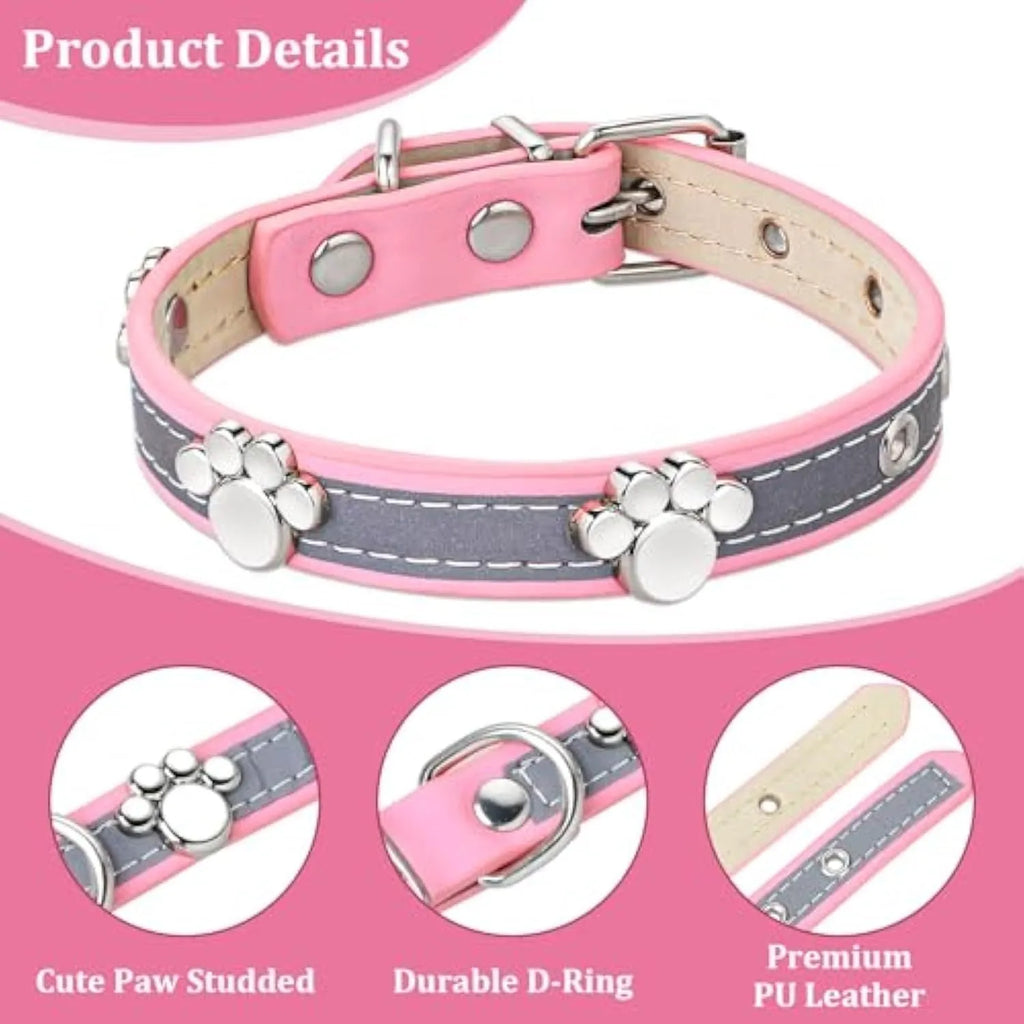 Reflective adjustable leather dog collar with cute paw rivet on a grey background.