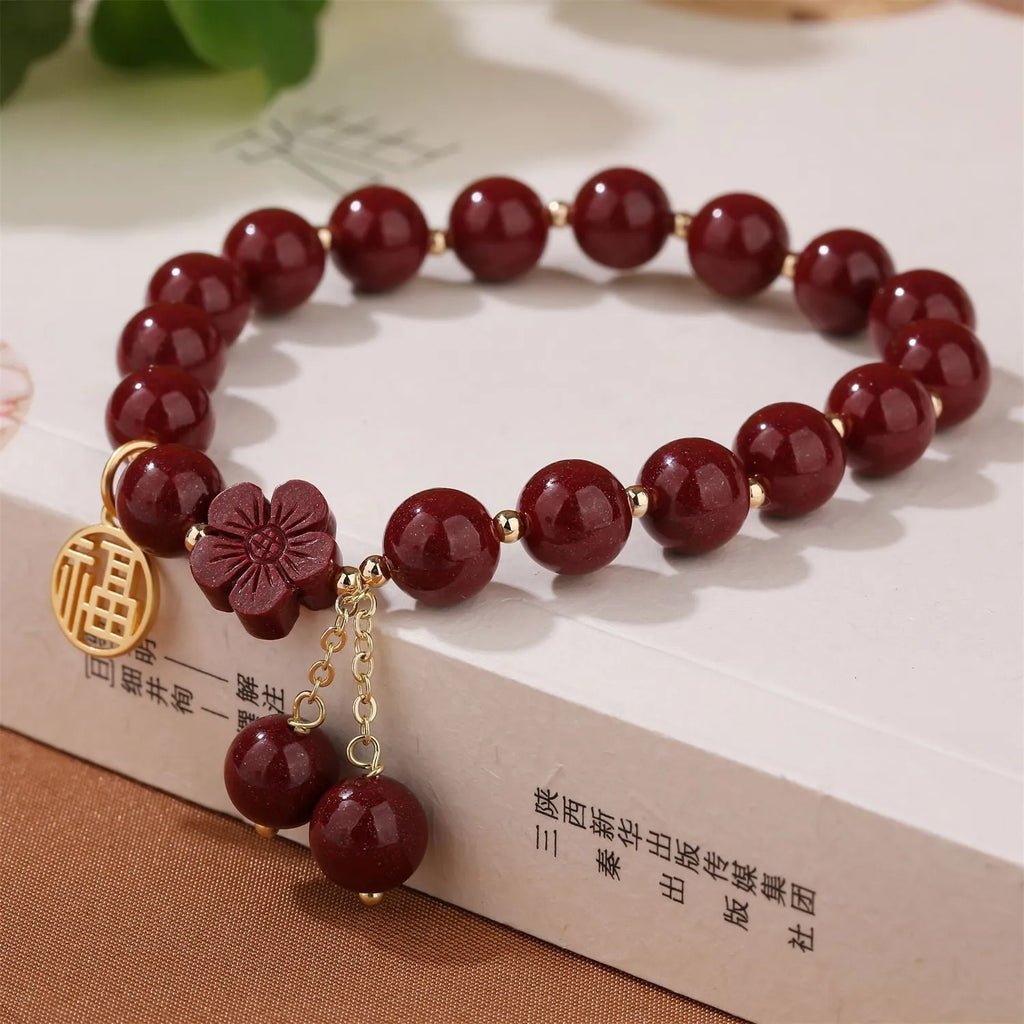 Women's cinnabar bracelet with fu character design and adjustable tassel closure in national style