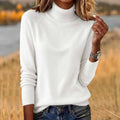 Women's solid colour loose fit long sleeve pullover sweater in white, polyester fabric, front view