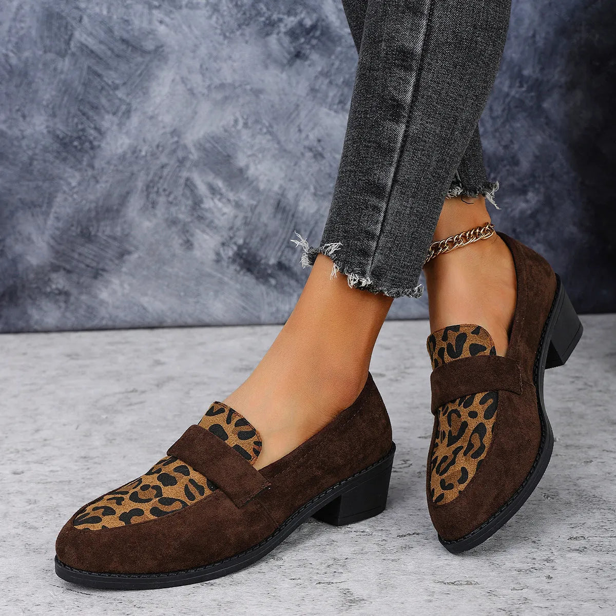 Leopard print suede slip-on pumps with a chunky heel and pointed toe in pink, brown, and khaki.