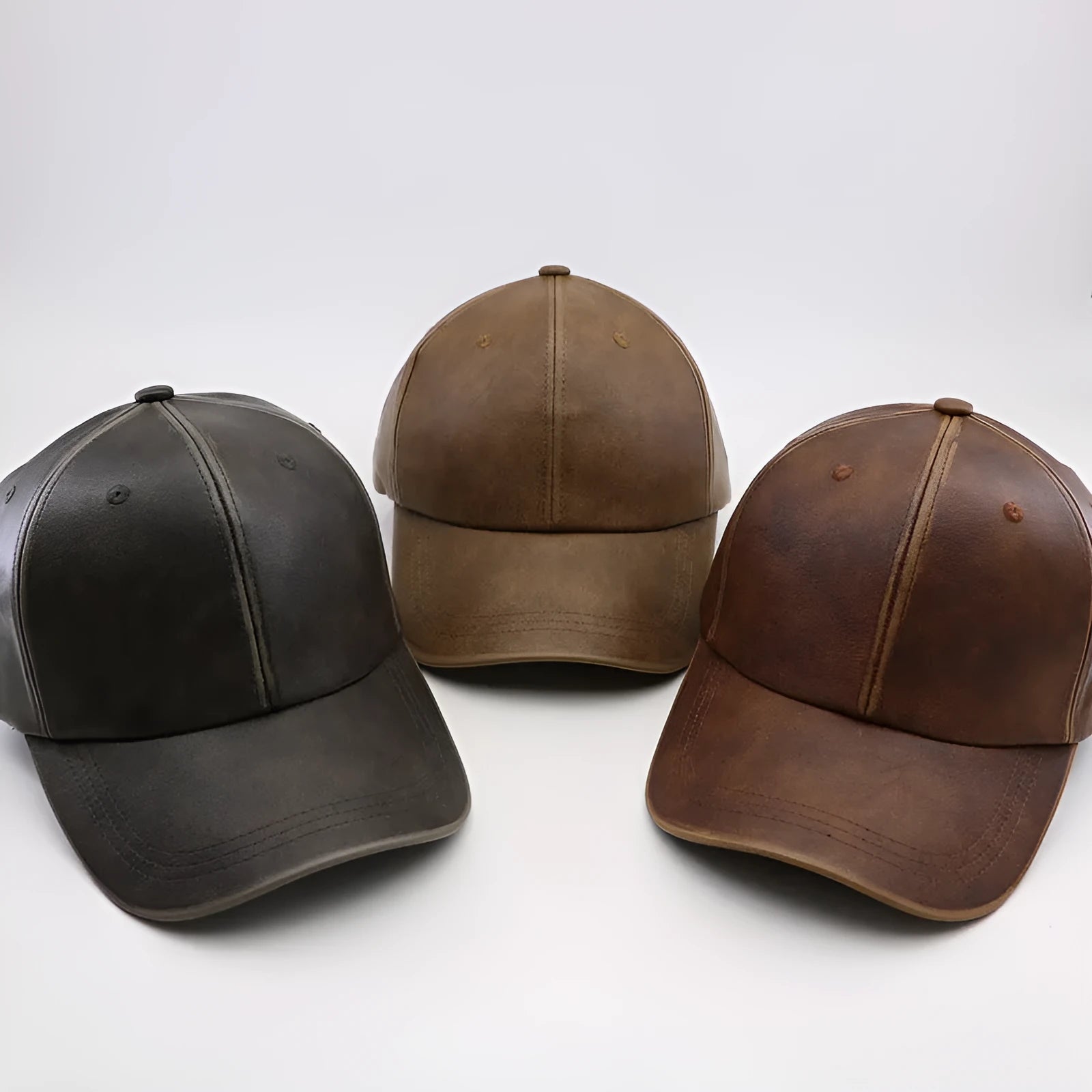 Washed and worn PU baseball cap with hard top peak, adjustable dome crown, brown colour, street travel fashion