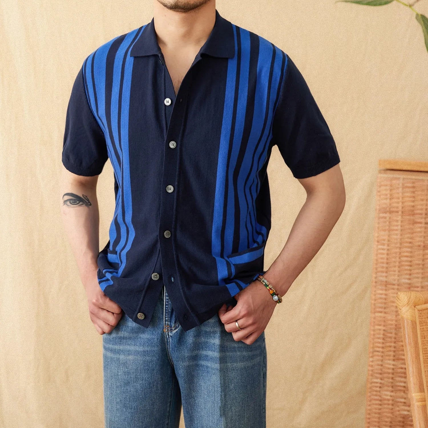Men's striped short-sleeved polo shirt with a knitted cardigan design in light blue.