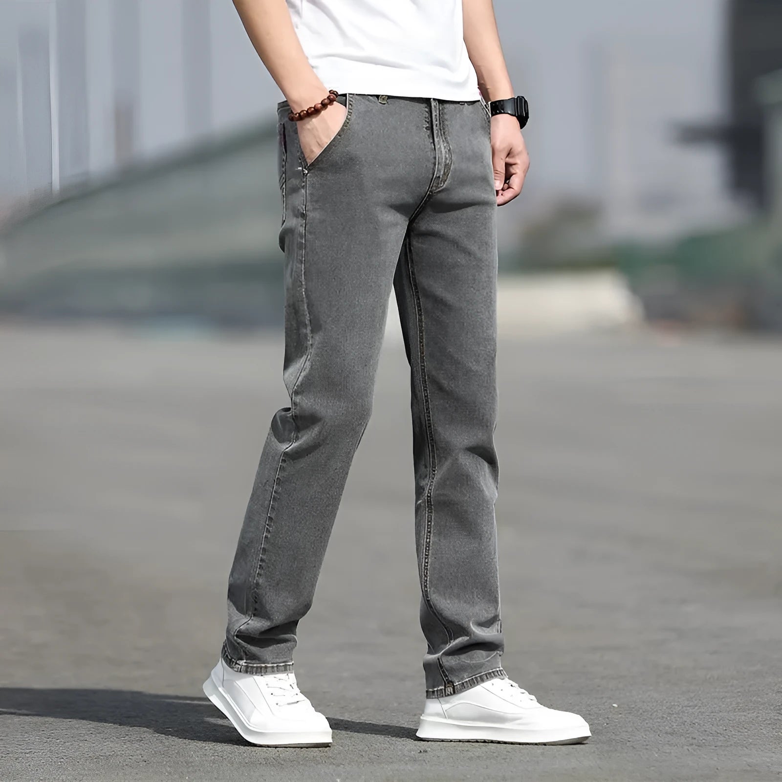 Men's straight-leg jeans in smoky grey colour with low waist design and zipper fly closure