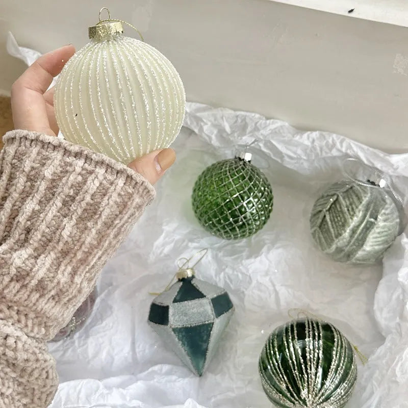 Handmade glass Christmas ball pendant 8cm in green colour hanging on tree branch
