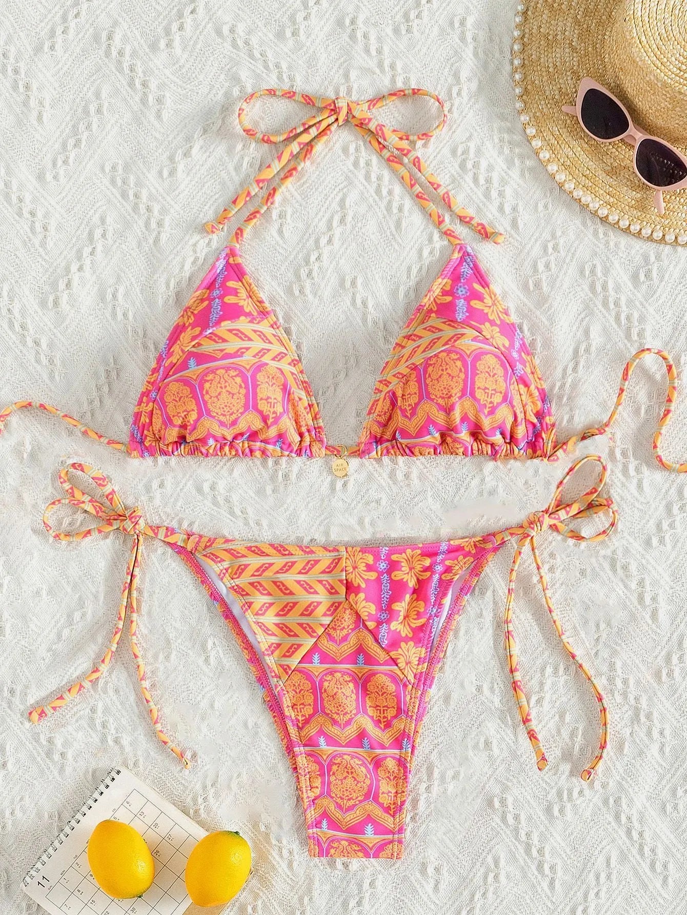Women's bandage swimsuit with split bikini printing and stitching details in polyester fabric