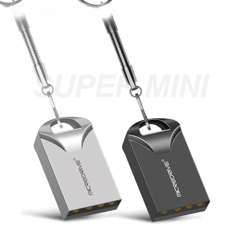 Small black and silver metal USB flash drive showing miniature size