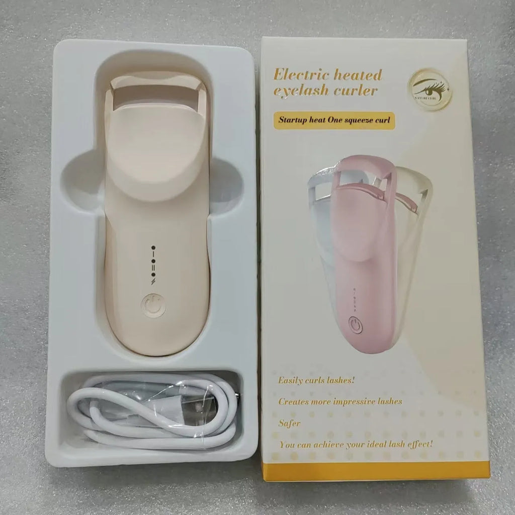USB electric heating eyelash curler in plastic, shown with data cable.