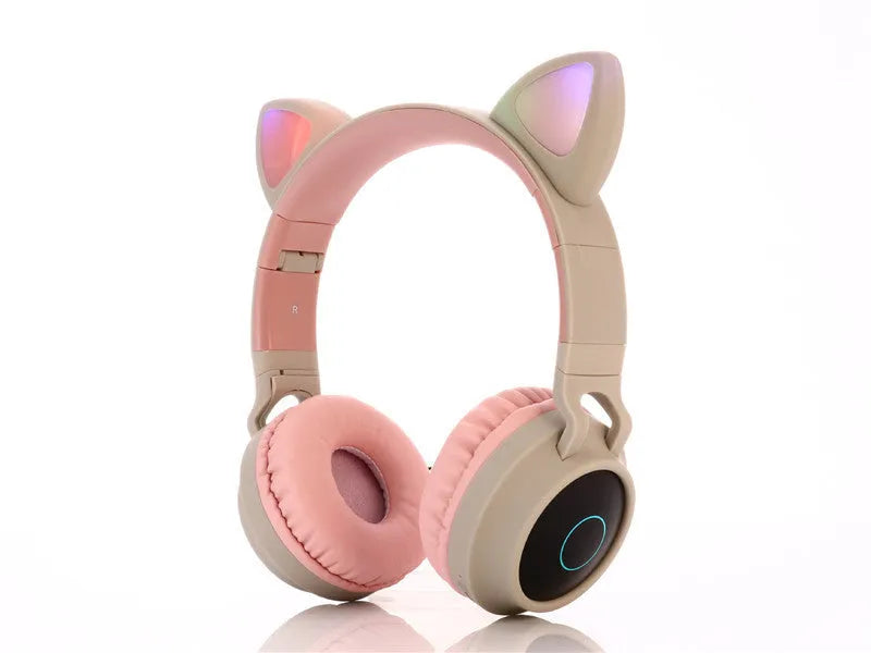 Pink wireless gaming headset with cartoon cat ears and head-mounted design
