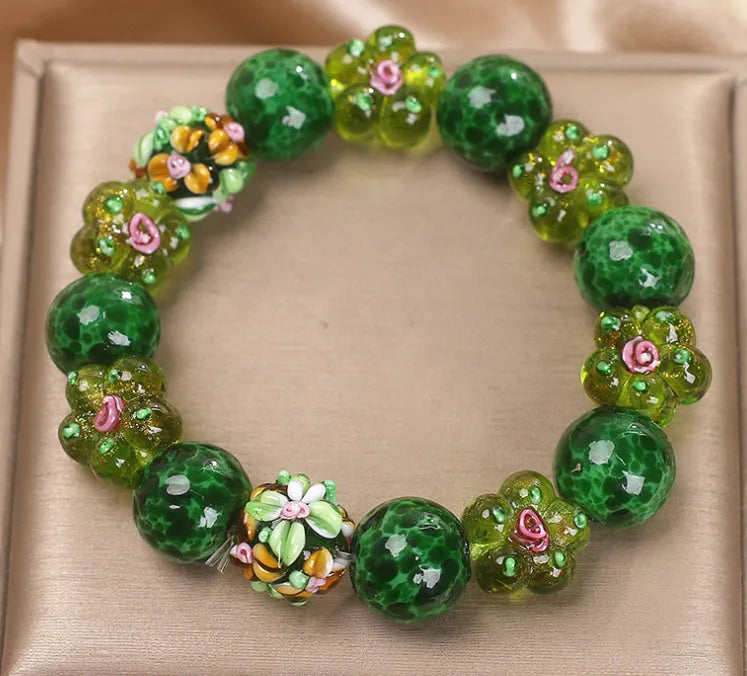Chinese ancient flower glazed bracelet for women, green electroplated finish with floral charm