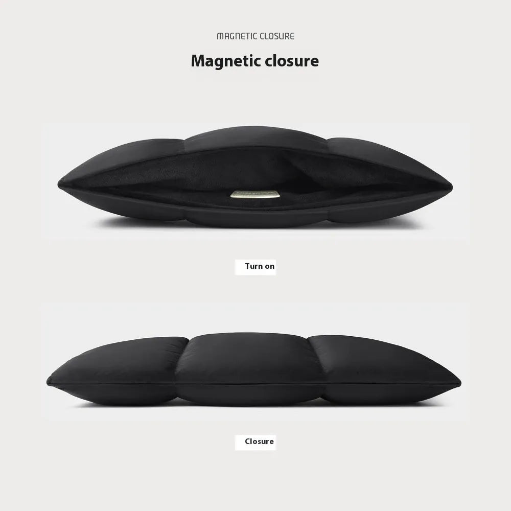 Black soft fluffy polyester laptop sleeve for 13 to 15.6 inch devices on a table