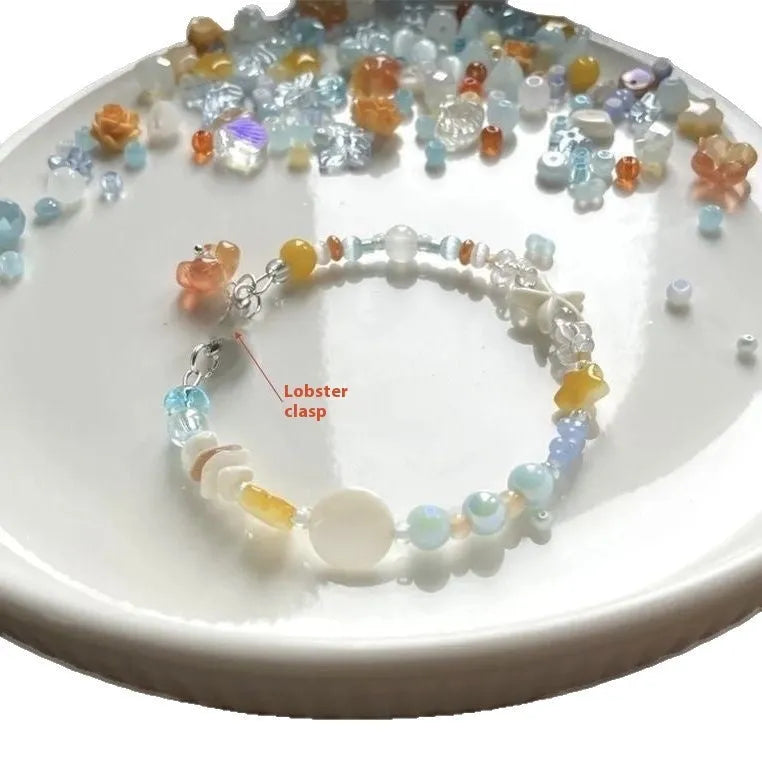 Orange sea coloured alloy bracelet with diamond shape and round element design for women