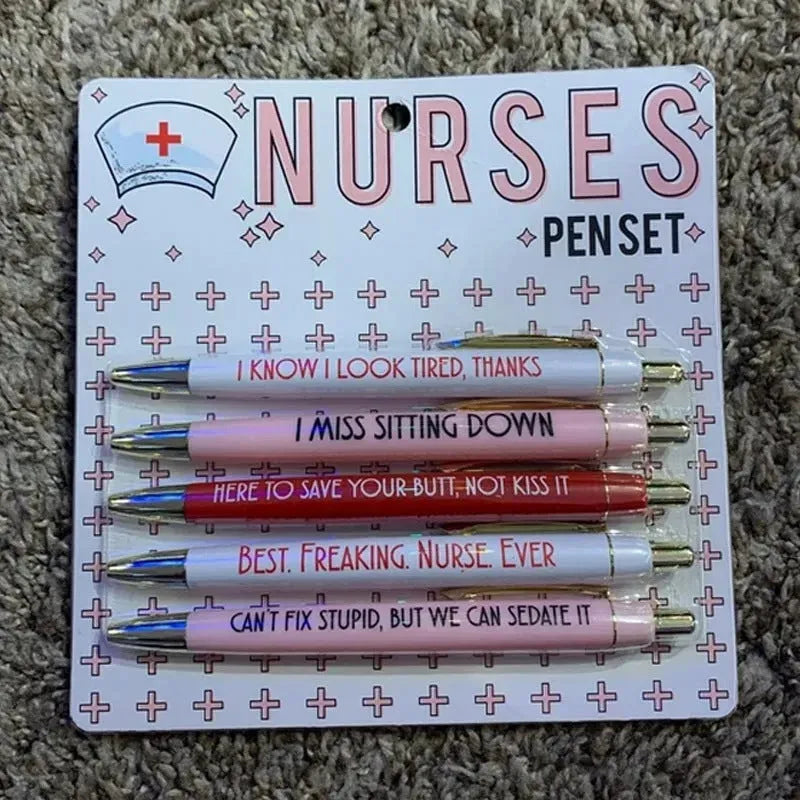 Five blue retractable ballpoint pens with white nurse-themed text, laid side by side.
