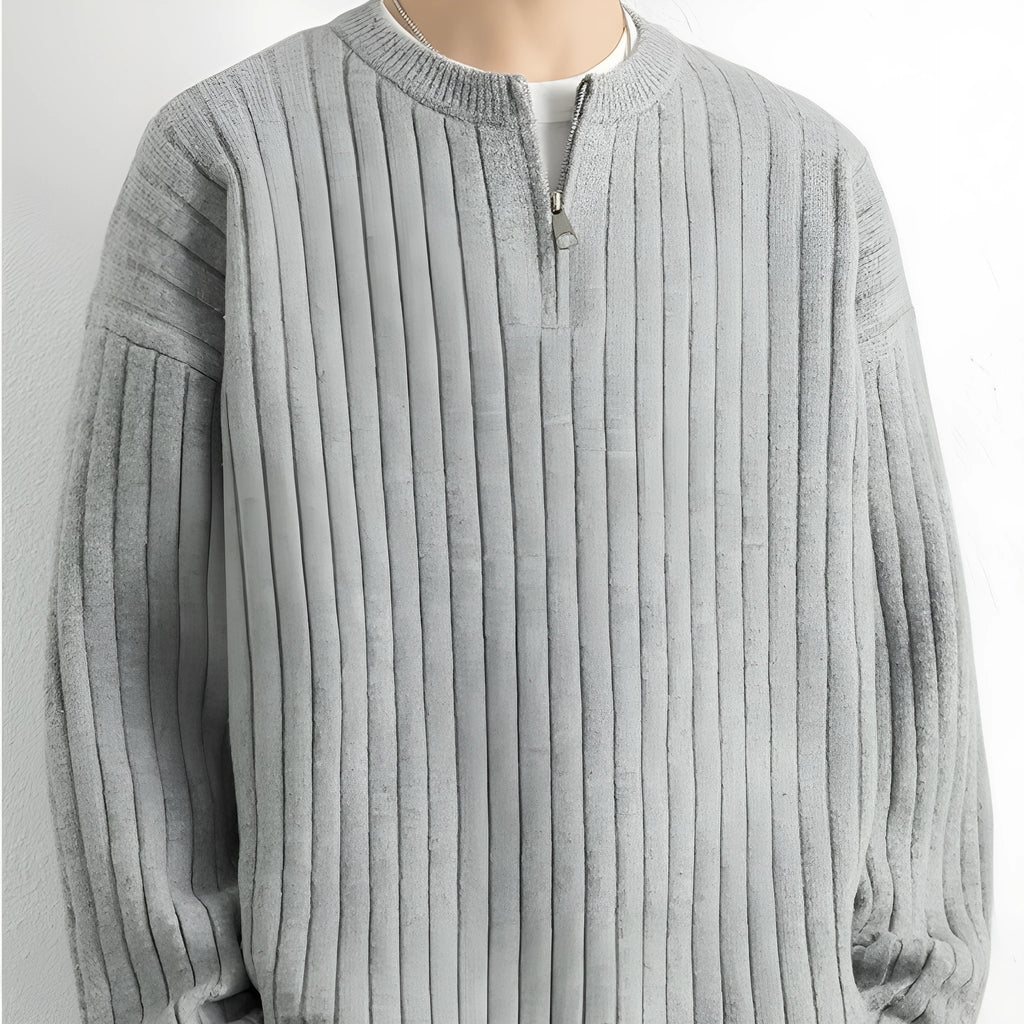 Men's loose grey half zipper textured knit sweater on a hanger.