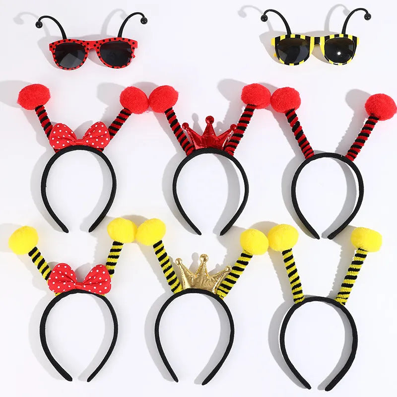 Yellow children's fancy dress set with bee motif headband and matching insect glasses.