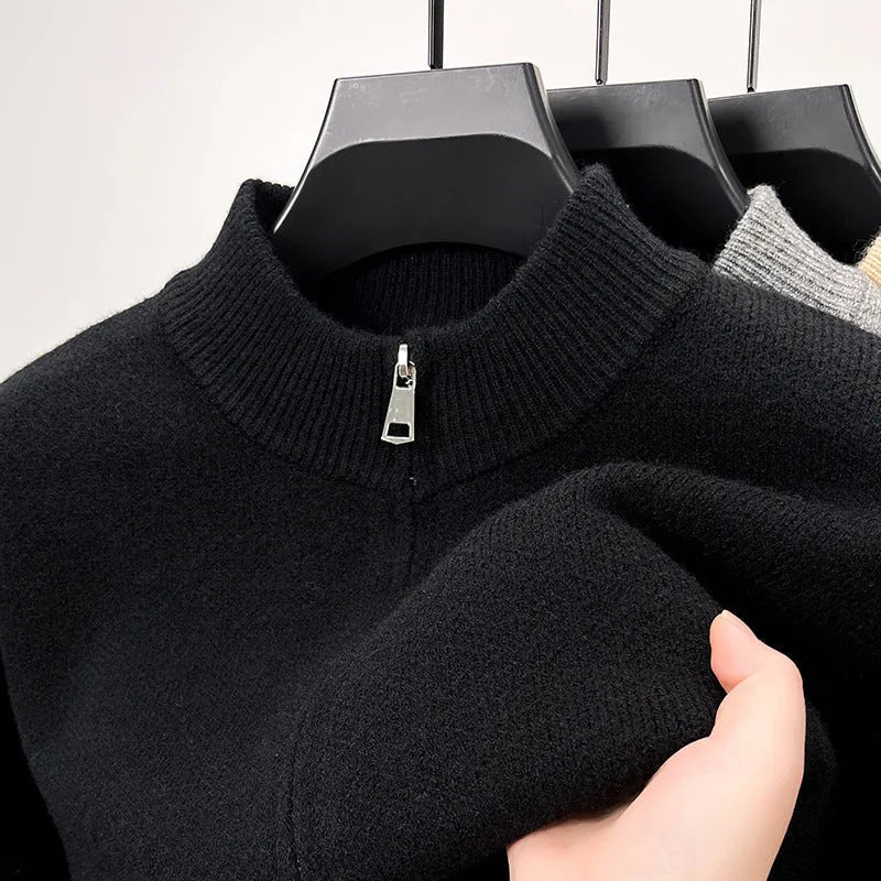 Men's black knitted cardigan with a stand collar and full-length front zipper, shown in a loose fit.