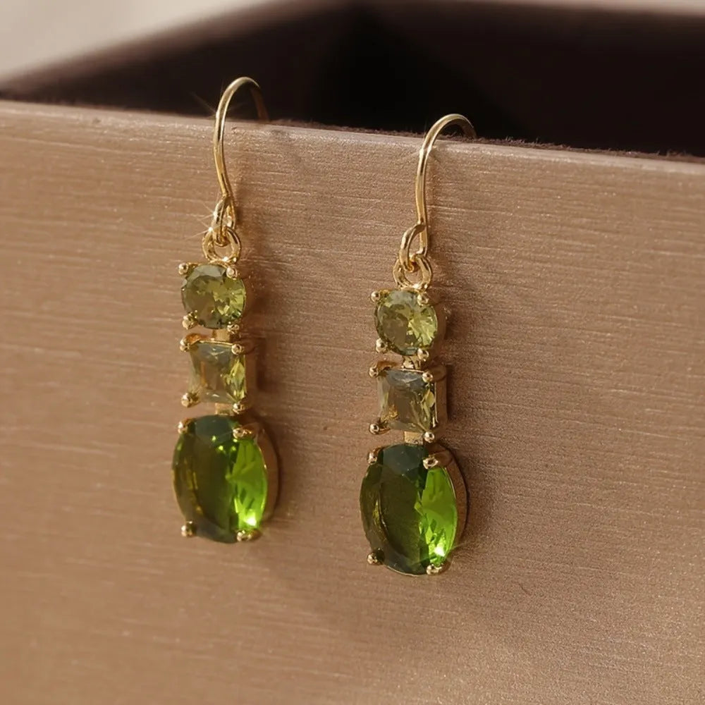 A pair of green copper geometric earrings with a quadrilateral shape and retro bohemian style.
