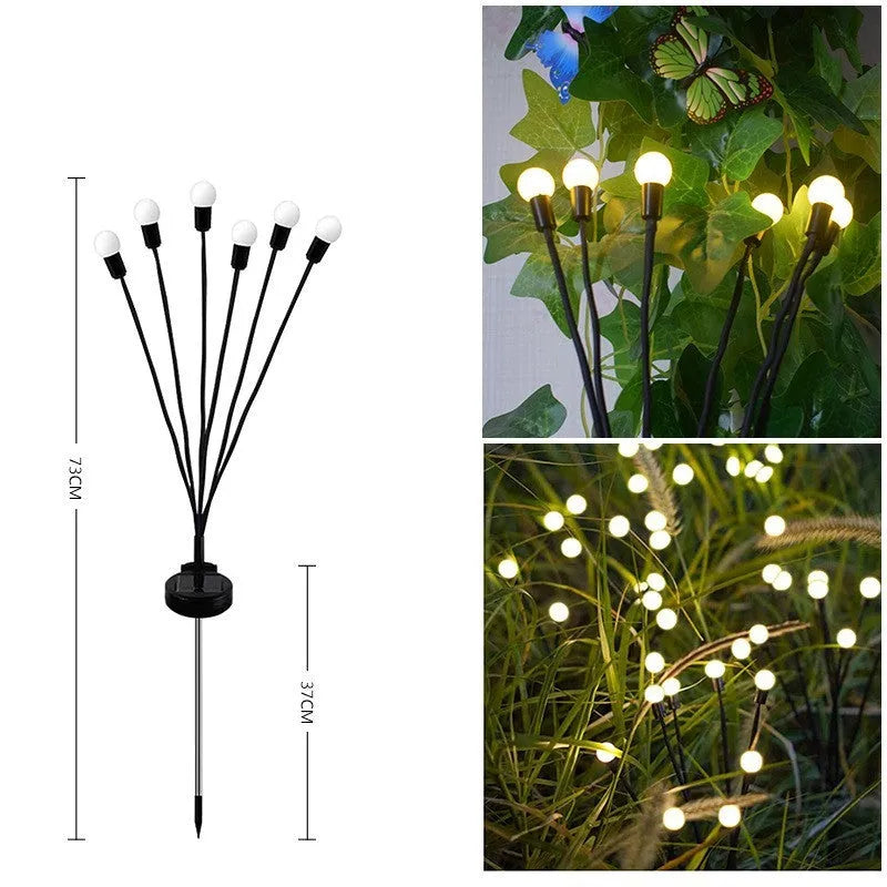 Solar powered LED ground spike garden light with multiple warm white and colour LED heads on stainless steel stake.