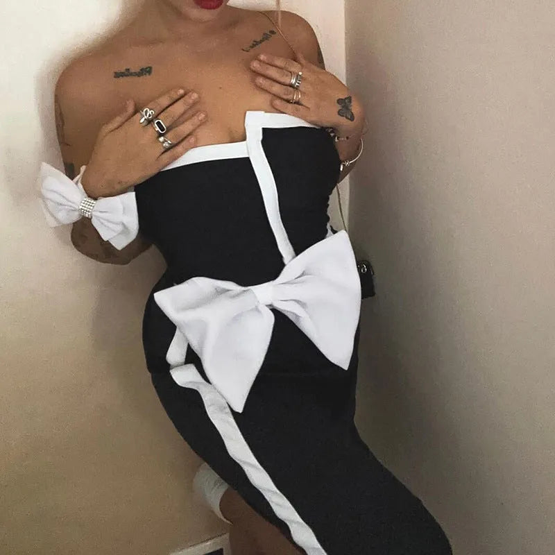 Women's black and white colour-block one-piece swimsuit with irregular tube top and bow detail