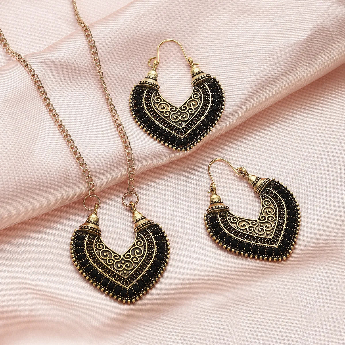 Rope winding heart-shaped earrings and matching necklace set with electroplated alloy pendants, shown in one of five colours