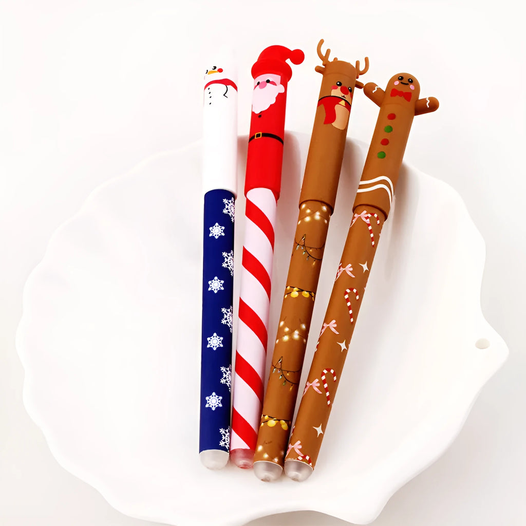 Four Christmas-themed erasable gel pens with Santa, gingerbread man, elk, and snowman designs on a white background