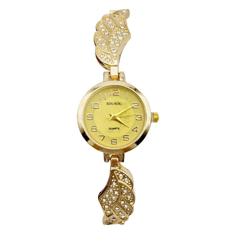 Women's stainless steel watch with round dial showing gold surface colour and vachette clasp