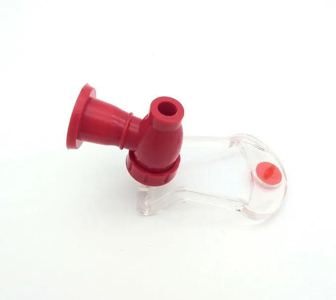 Red plastic Magic Tap soda dispenser attached to inverted 2-litre bottle
