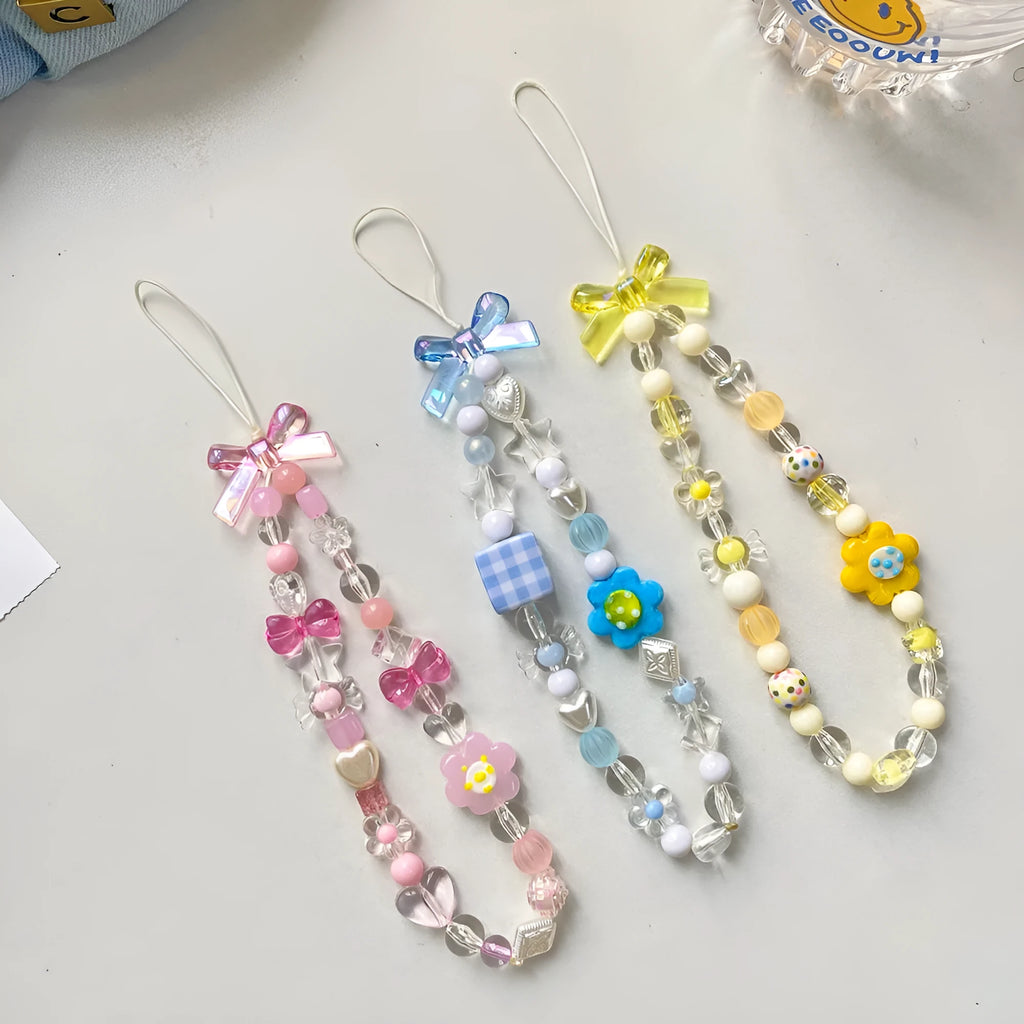 Beaded flower mobile phone lanyard with adjustable sliding bead in blue, pink, and yellow colour options