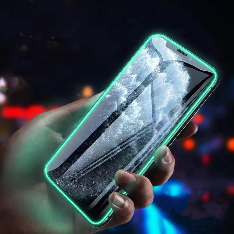 Luminous full cover tempered glass screen protector glowing for iPhone on a dark background.