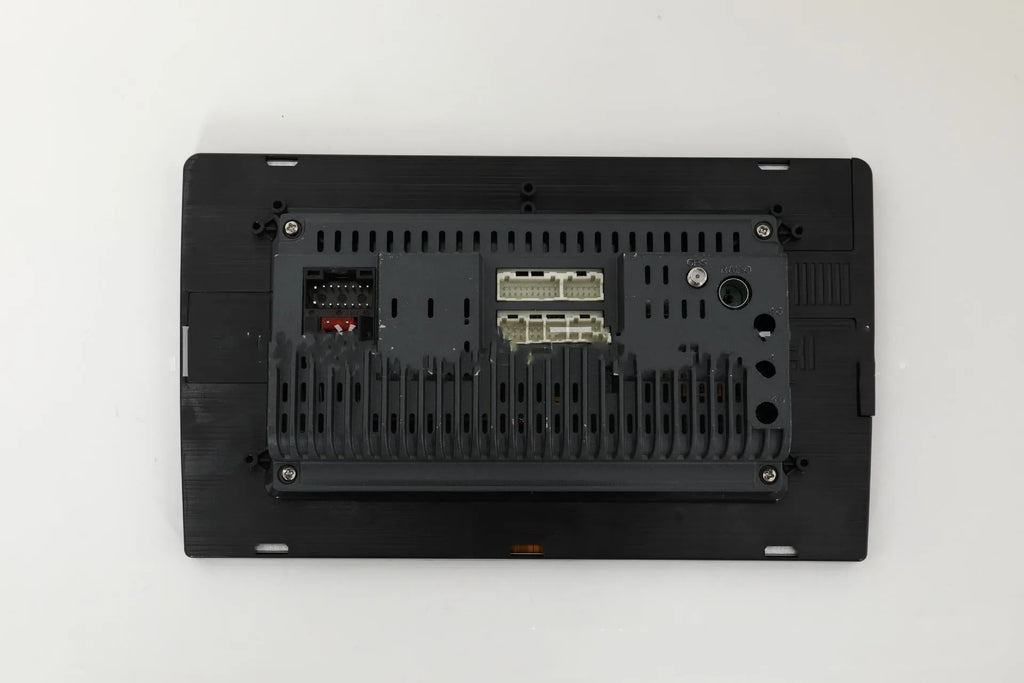 10.1 inch universal Android car stereo head unit with trapezoid touch screen display for dashboard installation.
